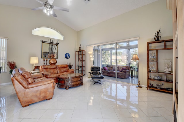 living room featuring high vaulted ceiling, light tile patterned floors, and ceiling fan