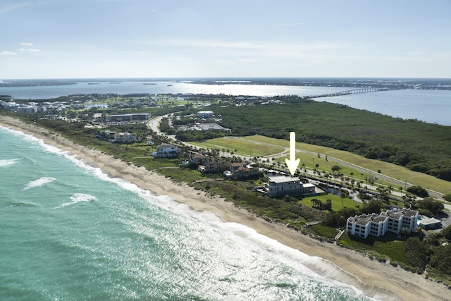 aerial view featuring a view of the beach and a water view