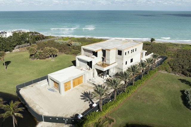 bird's eye view featuring a water view and a beach view