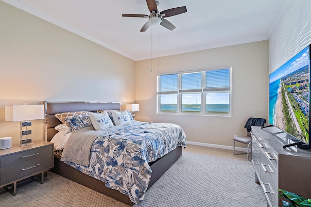 bedroom featuring ornamental molding, light carpet, and ceiling fan