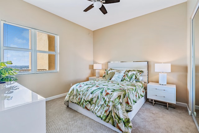 bedroom with light colored carpet and ceiling fan