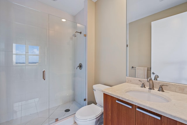 bathroom featuring an enclosed shower, vanity, and toilet