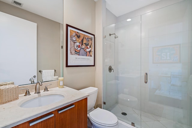 bathroom featuring walk in shower, vanity, and toilet