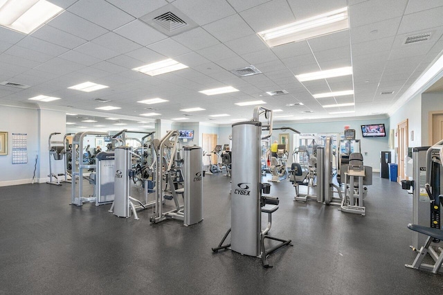 workout area featuring a paneled ceiling