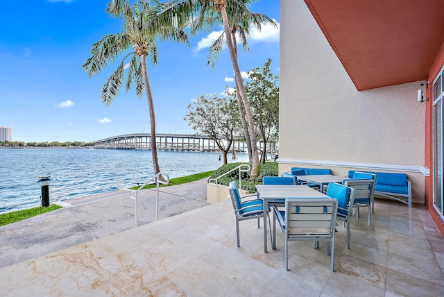 view of patio / terrace with a water view