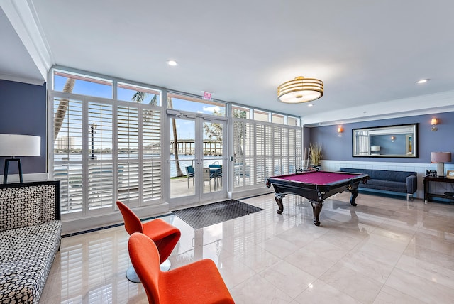 game room featuring expansive windows, pool table, a healthy amount of sunlight, and crown molding