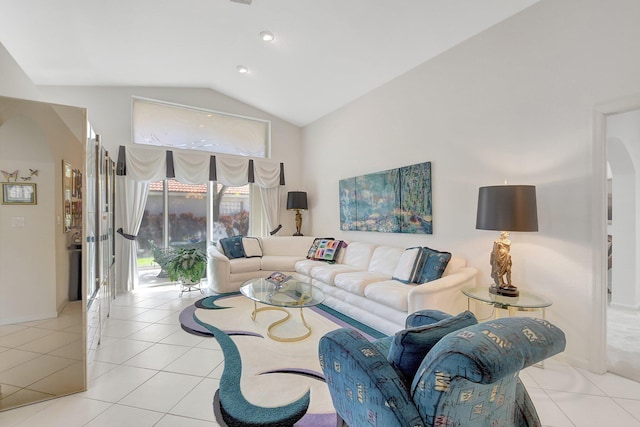 living room with arched walkways, vaulted ceiling, recessed lighting, and light tile patterned floors