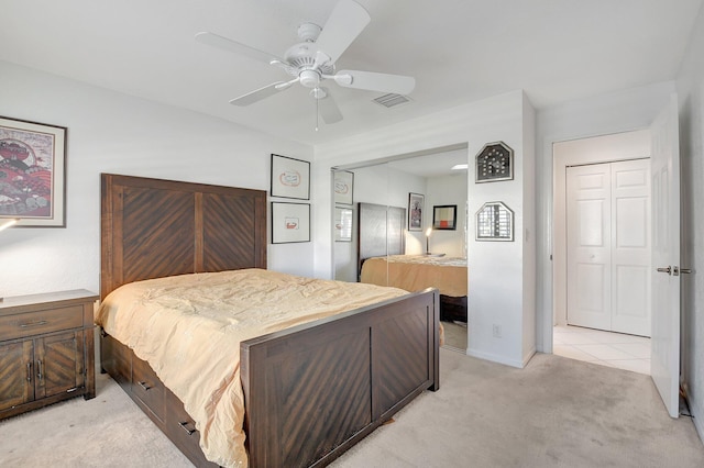 bedroom featuring light carpet, ceiling fan, visible vents, and baseboards