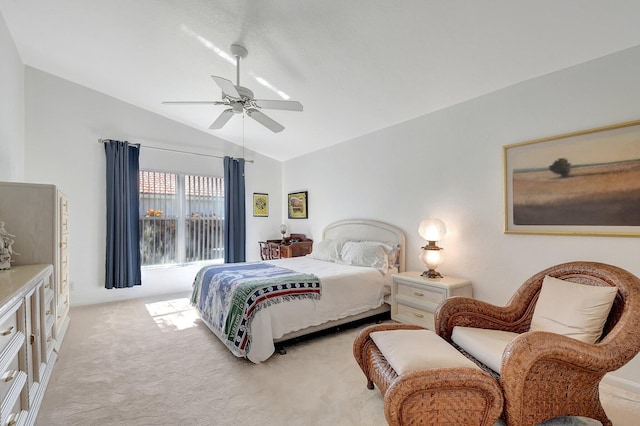 carpeted bedroom with vaulted ceiling and ceiling fan