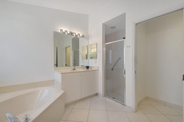 full bath with a stall shower, tile patterned flooring, vanity, and a bath