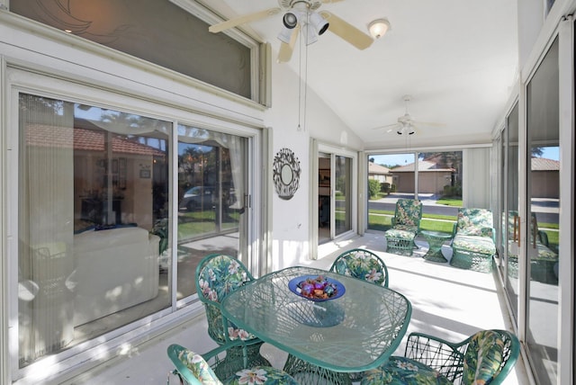 sunroom featuring lofted ceiling and ceiling fan