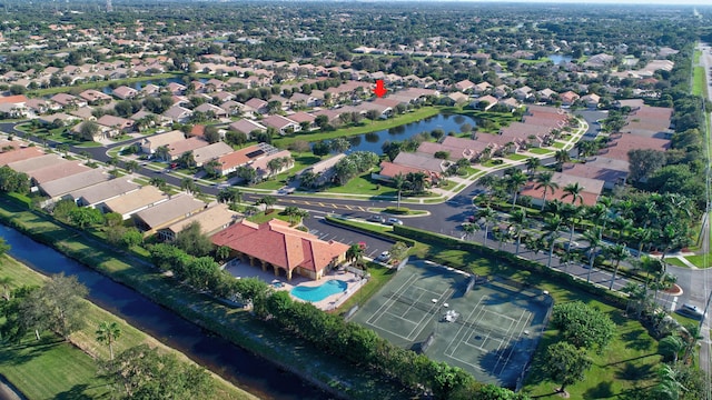 bird's eye view featuring a residential view and a water view