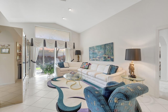 living room featuring light tile patterned flooring and vaulted ceiling