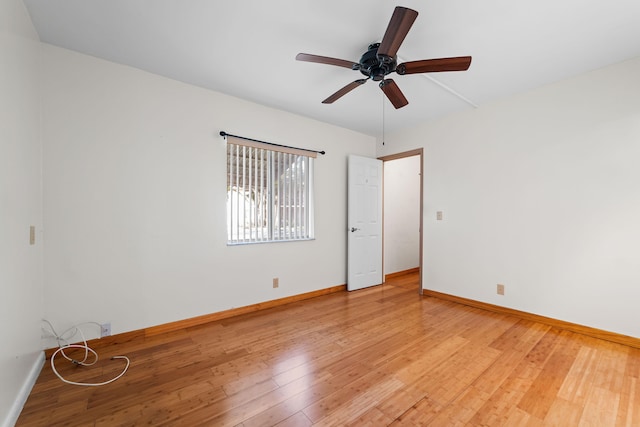 empty room featuring hardwood / wood-style floors and ceiling fan