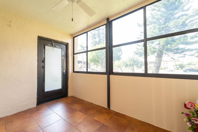 interior space featuring ceiling fan