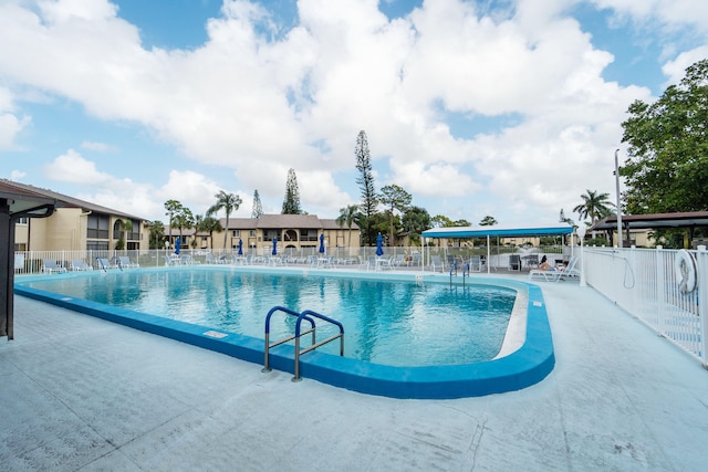 view of swimming pool featuring a patio area