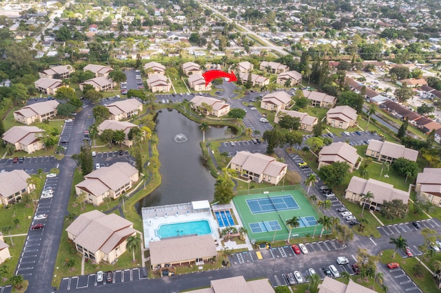 birds eye view of property featuring a water view