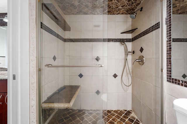 bathroom with tiled shower