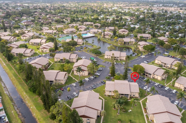 birds eye view of property featuring a water view