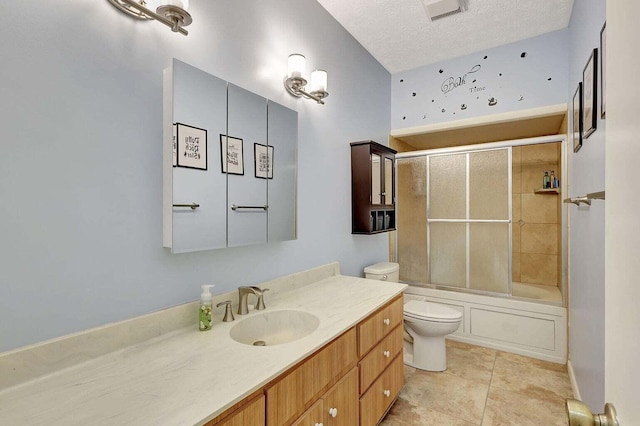 full bathroom with enclosed tub / shower combo, a textured ceiling, toilet, vanity, and tile patterned floors