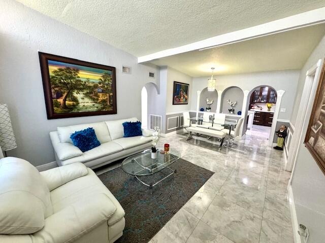 living room featuring a textured ceiling