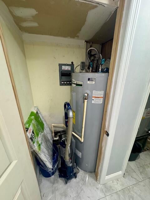 utility room featuring gas water heater