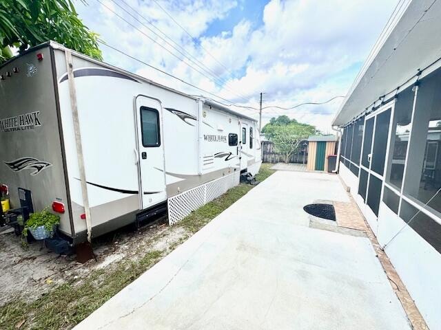 view of property exterior with a patio area