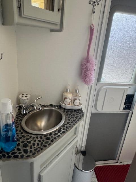 bathroom with a wealth of natural light and vanity