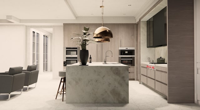 kitchen with double wall oven, sink, hanging light fixtures, stainless steel double oven, and a kitchen island with sink