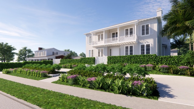 view of front of property featuring a balcony