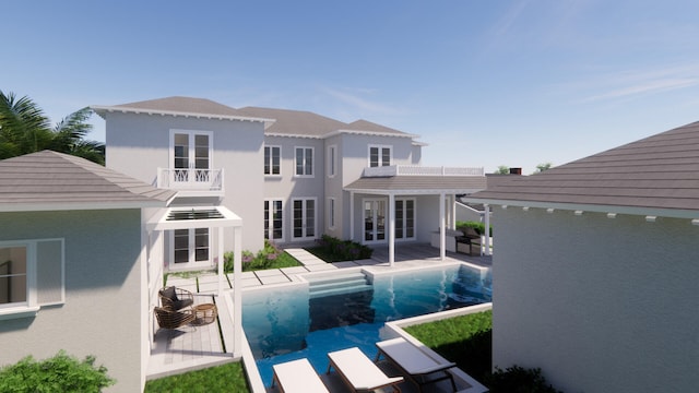 rear view of house with a pergola and a patio area