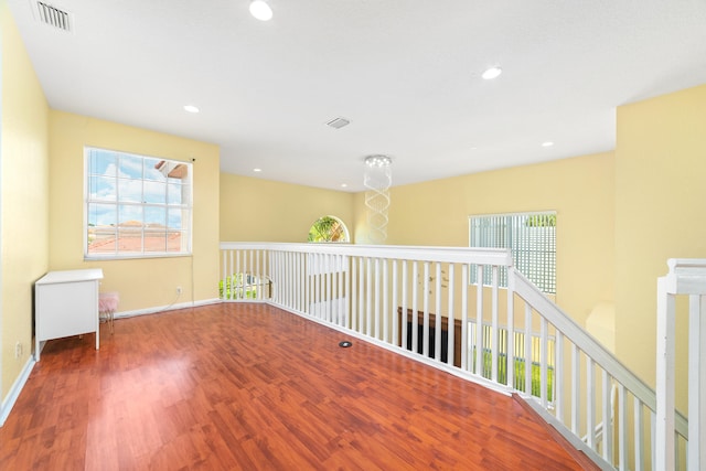 spare room with hardwood / wood-style floors