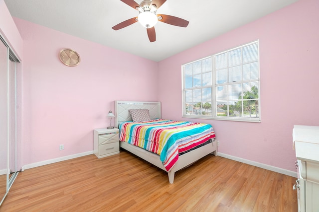 bedroom featuring ceiling fan and light hardwood / wood-style floors