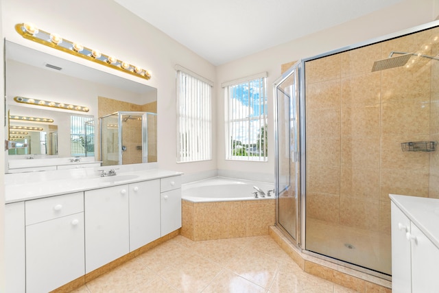 bathroom with vanity, shower with separate bathtub, and tile patterned floors