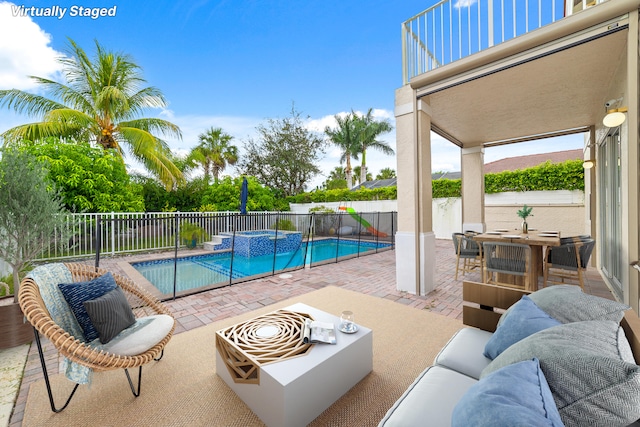 view of pool with an outdoor hangout area and a patio area