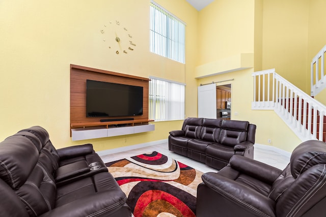 living room featuring a towering ceiling