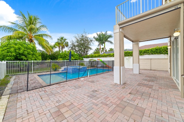 view of swimming pool with a patio area