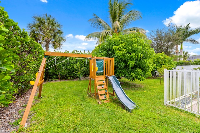 view of jungle gym featuring a lawn