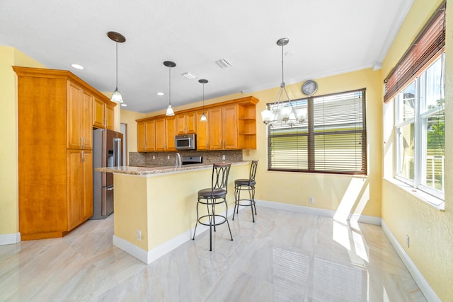 kitchen with stainless steel appliances, decorative backsplash, kitchen peninsula, ornamental molding, and pendant lighting