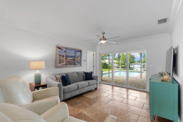 living room with ceiling fan and crown molding