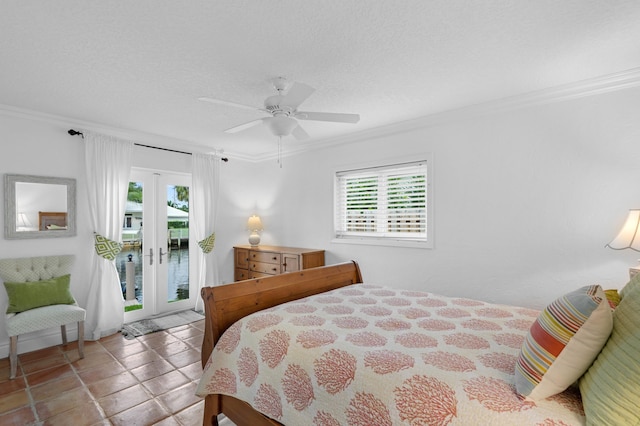 bedroom with access to exterior, ceiling fan, a textured ceiling, light tile patterned floors, and ornamental molding