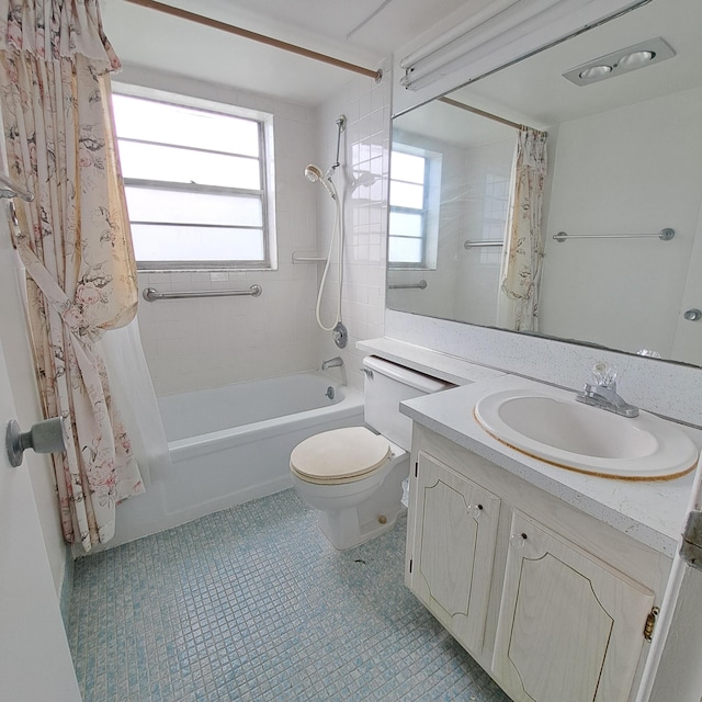 full bathroom featuring vanity, shower / tub combo with curtain, a healthy amount of sunlight, and toilet