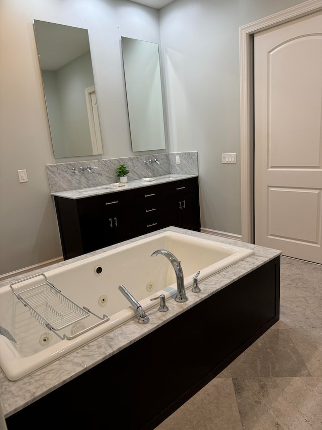 bathroom with a bathtub and vanity