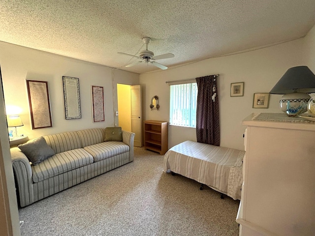 bedroom with carpet flooring, a textured ceiling, and ceiling fan