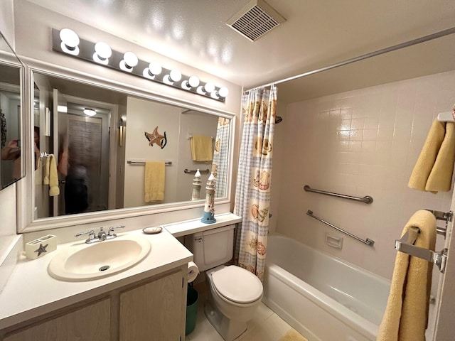 full bathroom with shower / tub combo with curtain, vanity, toilet, and tile patterned floors