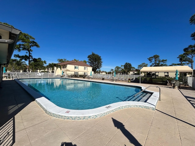 view of swimming pool featuring a patio