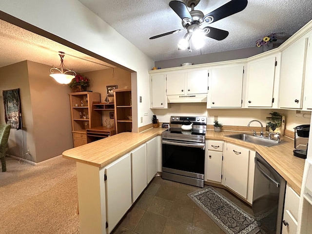 kitchen featuring white cabinetry, pendant lighting, sink, and stainless steel appliances