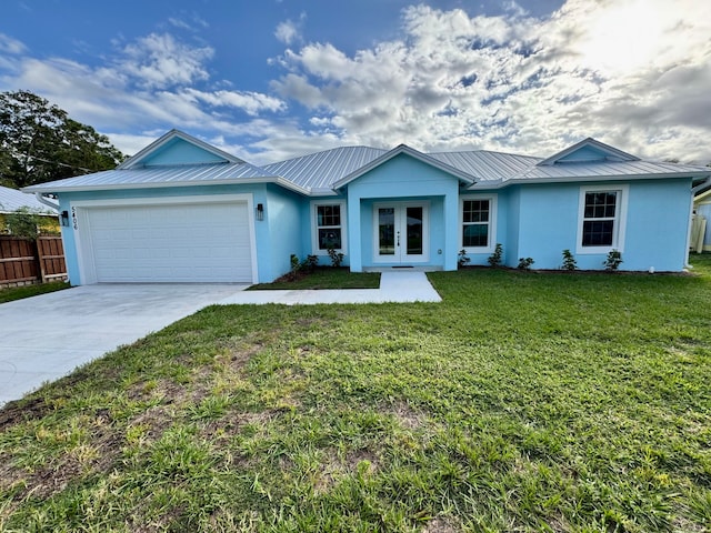 single story home featuring a front yard and a garage