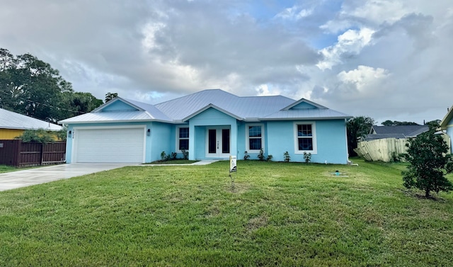 single story home featuring a front lawn and a garage