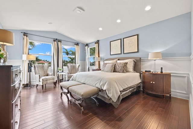 bedroom featuring dark wood-type flooring, multiple windows, and vaulted ceiling